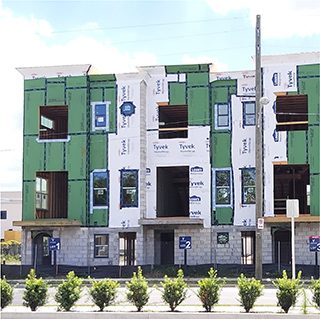 a picture of a townhome building under construction